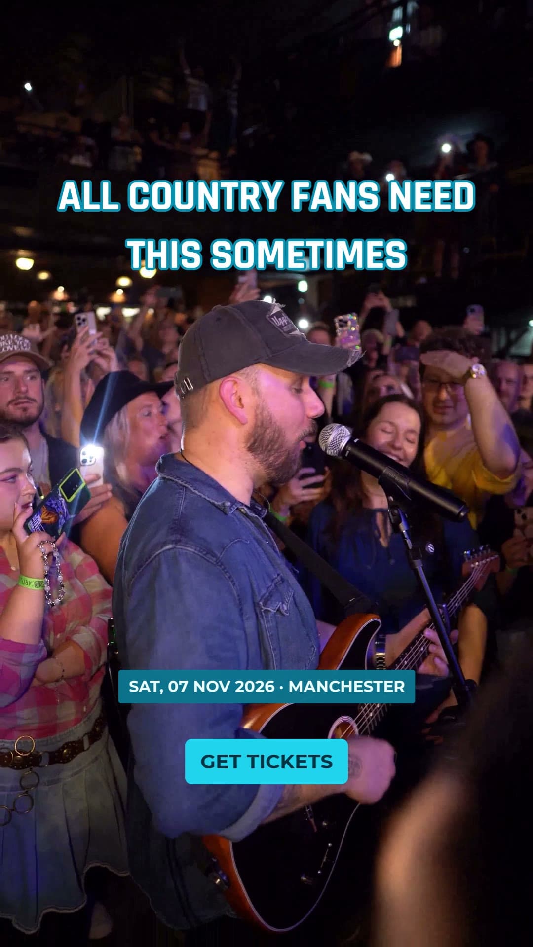 A still from a vertical video ad of Cody singing with fans around him