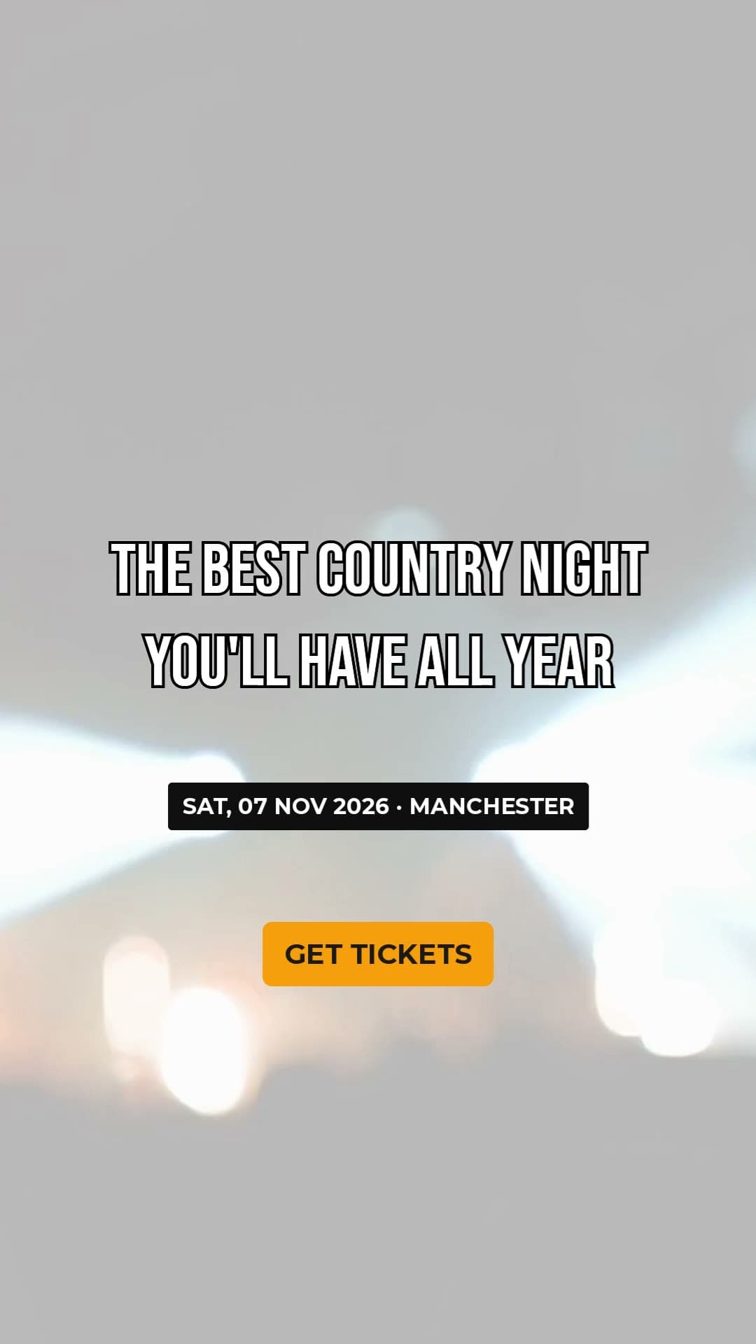 First frame of an ad: a grey blur of stage lights